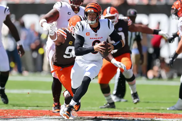Myles Garrett of the Cleveland Browns chases Cincinnati Bengals quarterback Joe Burrow