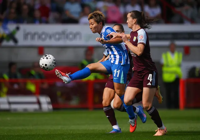 Kiko Seike of Brighton & Hove Albion controls the ball whilst under pressure from Anna Patten of Aston Villa during the Barclays Women's Super League match between Brighton & Hove Albion and Aston Villa at Broadfield Stadium