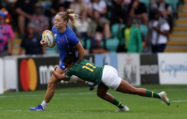Joanna Grisez of France is tackled by Maceala Samboya