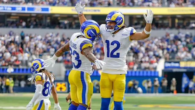 Kyren Williams celebrates with Los Angeles Rams team-mate Puka Nacua during their game against the Houston Texans