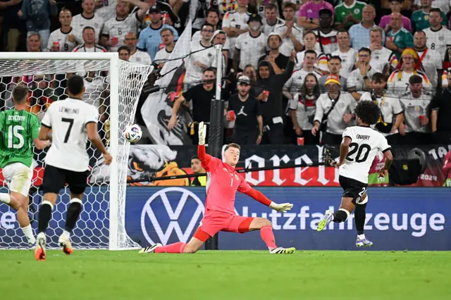 Serge Gnabry of Germany scores his team's first goal past Bailey Peacock-Farrell of Northern Ireland