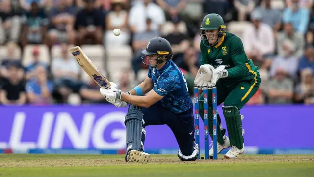 Jacob Bethell scoops past the wicketkeeper