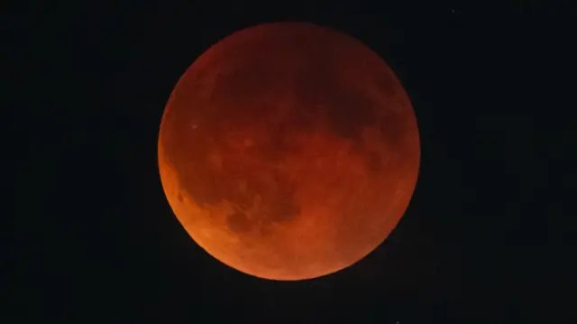 The blood moon rises over Vienna during a total lunar eclipse on September 07, 2025 in Vienna, Austria
