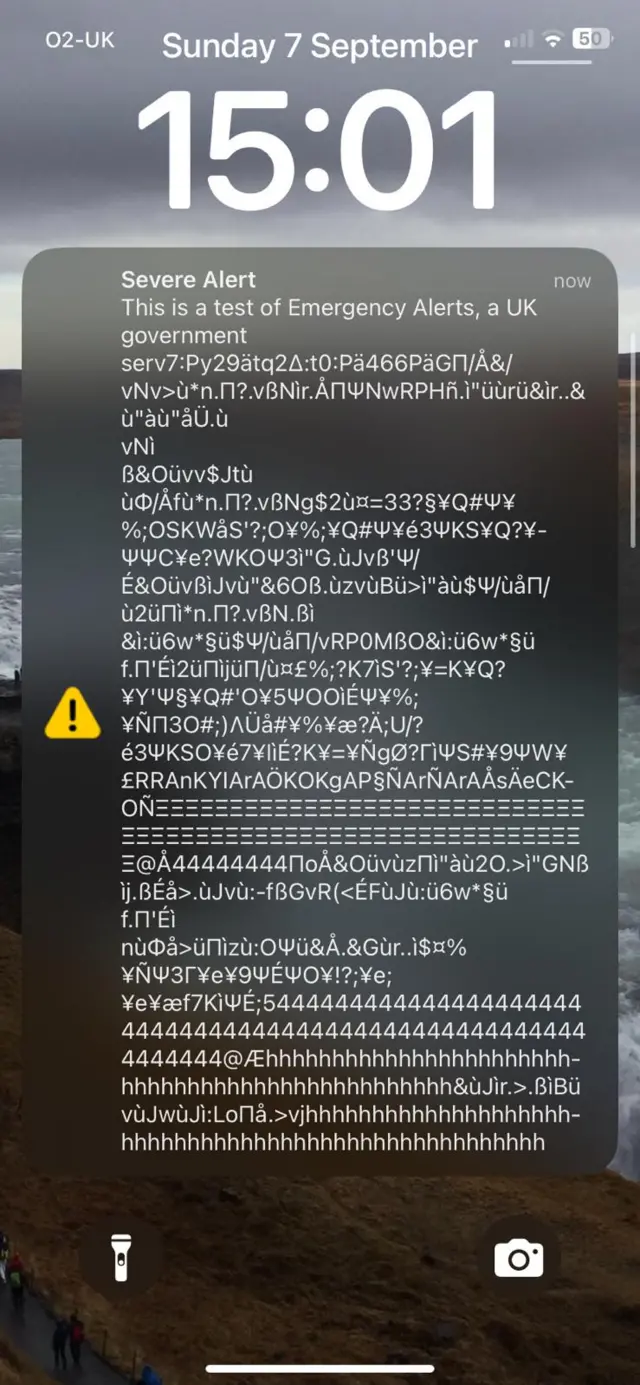 A garbled up message showing on a mobile phone