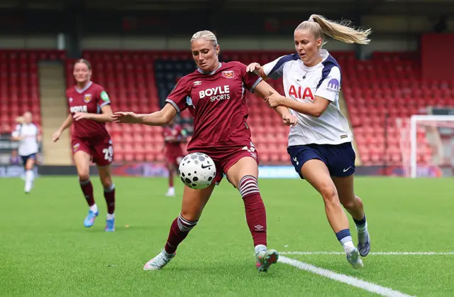 Shelina Zadorsky of West Ham United is challenged by Olivia Holdt of Tottenham Hotspur during the Barclays Women's Super League match between Tottenham Hotspur and West Ham United at BetWright Stadium on September 07, 2025 in London, England.