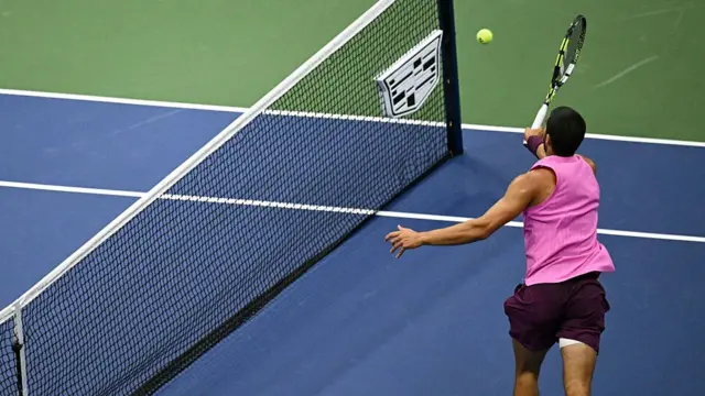 Spain's Carlos Alcaraz plays a forehand r