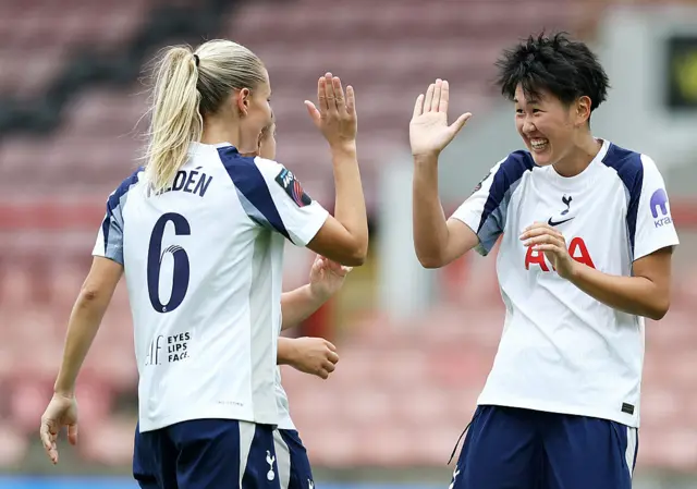 Toko Kago and Amanda Nilden high five