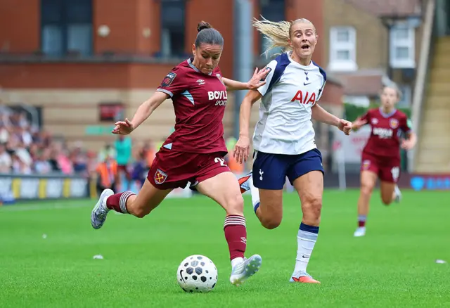 : Ffion Morgan of West Ham United shoots whilst under pressure from Amanda Nilden of Tottenham Hotspur during the Barclays Women's Super League match between Tottenham Hotspur and West Ham United at BetWright Stadium