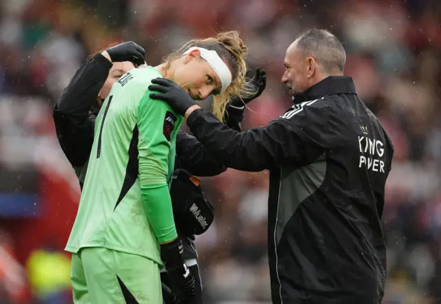 Leicester City goalkeeper Janina Leitzig is treated for an injury,