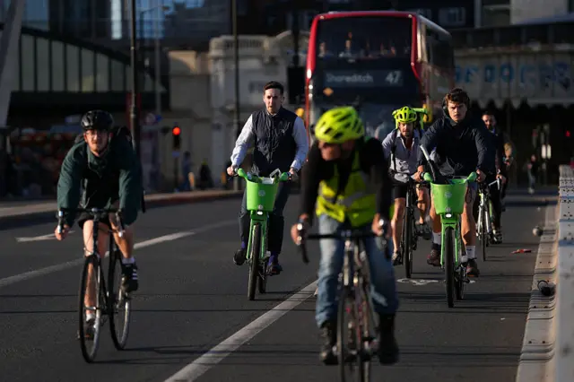 Members of the public cycle across London Bridge early in the morning of September 8, 2025, as most of London Underground services are suspended during strike action by members of the Railway workers' union RMT.