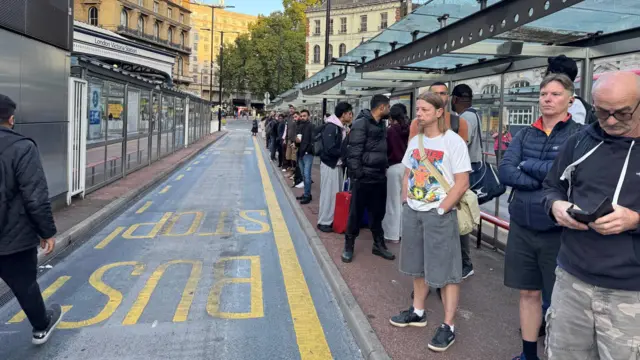 Long queues form at London Victoria station