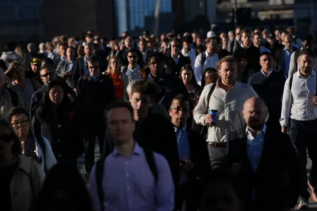 Commuters cross London Bridge early in the morning of September 8, 2025, as most of London Underground services are suspended during strike action by members of the Railway workers' union RMT.