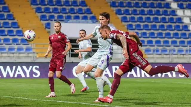 Belarus' Zakhar Volkov scores an own goal to make it 2-0
