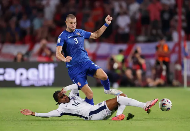 Strahinja Pavlovic of Serbia is tackled by Djed Spence