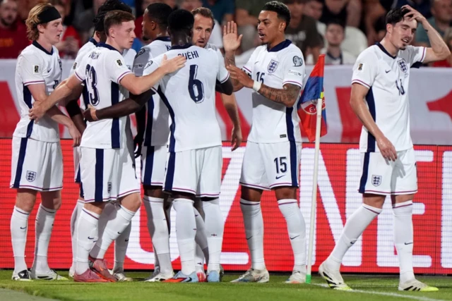 England's Harry Kane celebrates scoring the opening goal with team mates