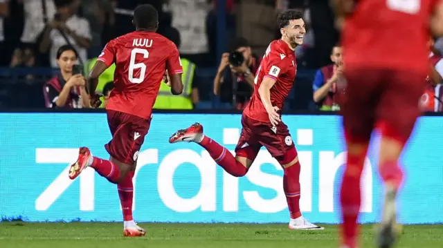 Armenia celebrating their second goal.