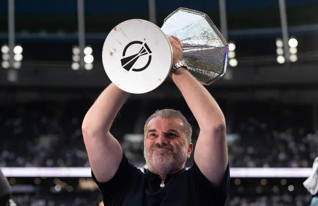 Tottenham Hotspur Head Coach Ange Postecoglou lifts the UEFA Europa League trophy