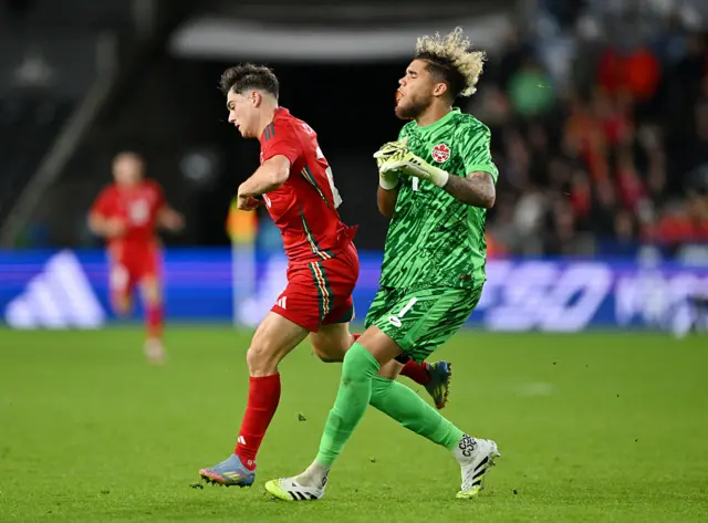 Daniel James of Wales and Dayne St. Clair of Canada clash