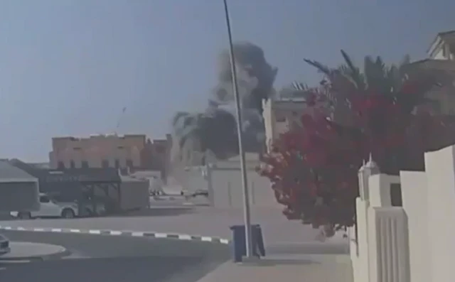 Smoke coming up over a building in Doha