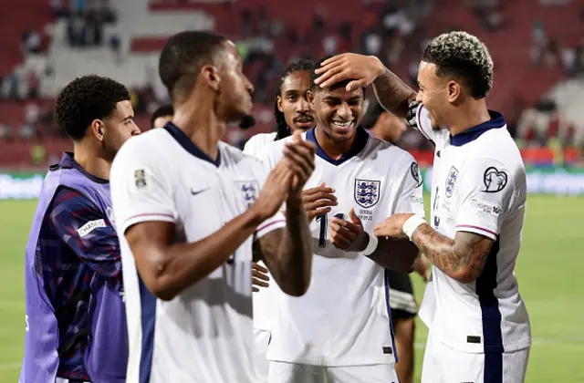 Marcus Rashford of England celebrates with his teammates at full-time
