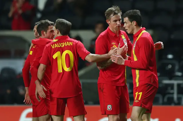 Wales players celebrate with Gareth Bale during the 2013 friendly against Austria
