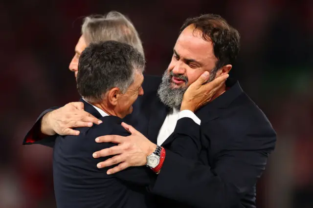 Olympiacos President Evangelos Marinakis embraces Olympiacos Manager Jose Luis Mendilibar