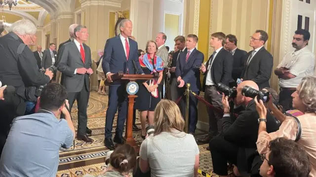 John Thune speaks to the press