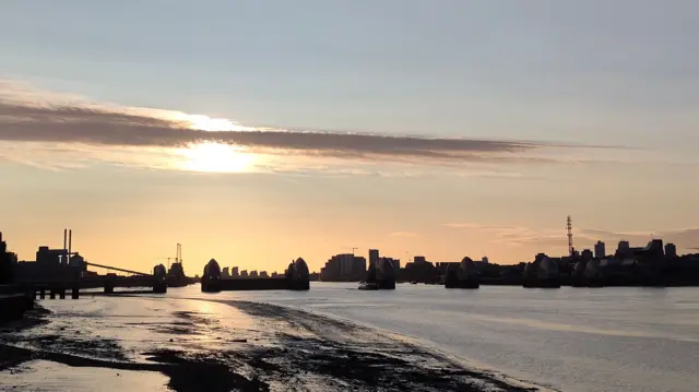 Landscape of London from river, against a sunny sky