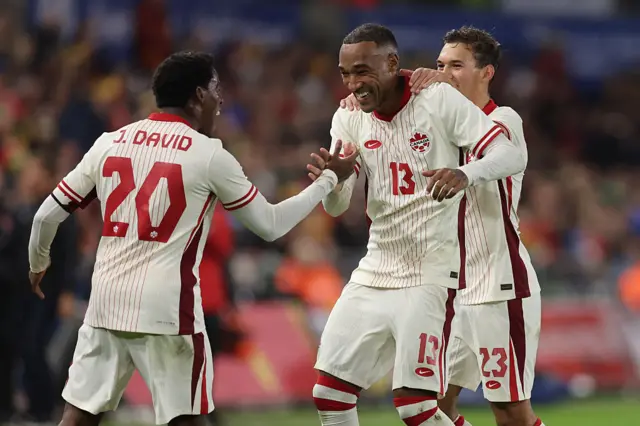 Canada players celebrate with Derek Cornelius
