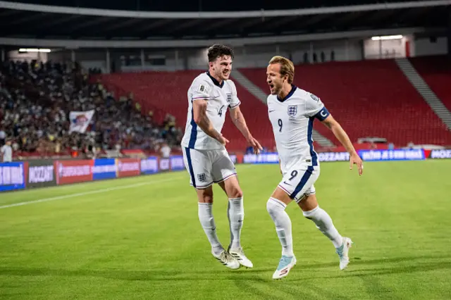 Harry Kane of England (R) celebrates with Declan Rice
