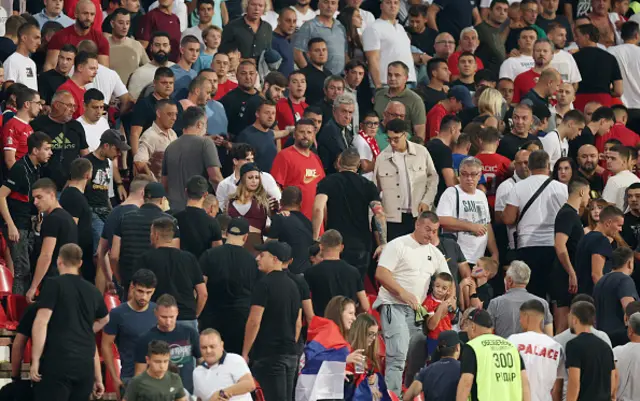 A general view inside the stadium as fans clash