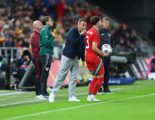 Wales boss Craig Bellamy speaks to Neco Williams