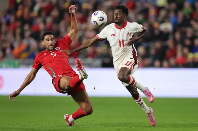 Wales' Ben Cabango makes a challenge