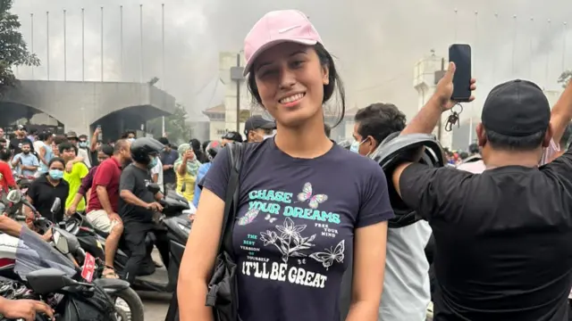 Muna Shreshta standing outside the parliament building