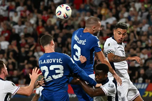 Dusan Vlahovic, defender #03 Strahinja Pavlovic, and England striker #15 Morgan Rogers (R) jump to head the ball