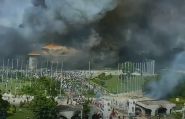Hugh plumes of smoke rising from the National Assembly building