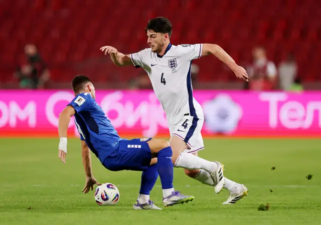 Declan Rice of England is challenged by Andrija Zivkovic