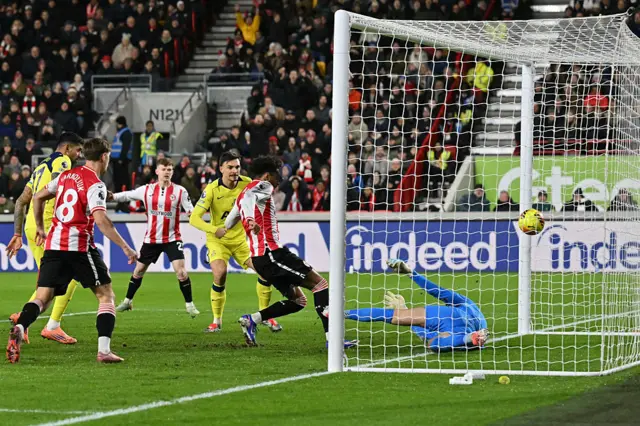 Brentford's German midfielder #07 Kevin Schade scores a goal which was subsequently disallowed