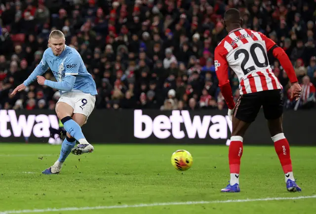Erling Haaland of Manchester City shoots at goal