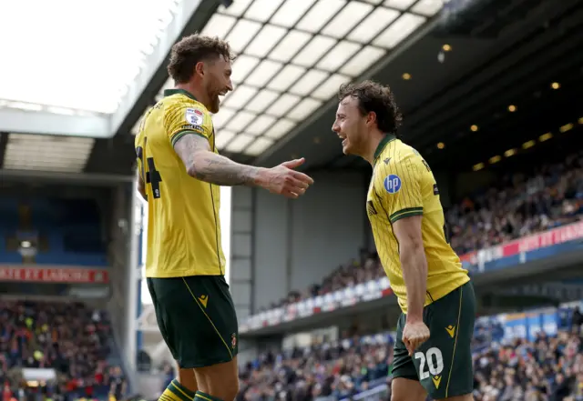Wrexham's Oliver Rathbone celebrates with a team-mate