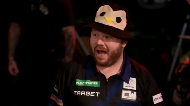 Justin Hood wears a penguin bucket hat