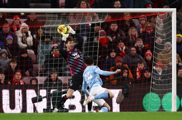 Manchester City's Josko Gvardiol heads at goal as Sunderland's Robin Roefs makes a save