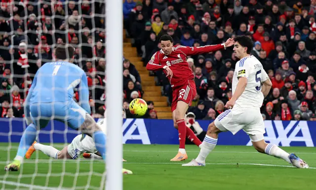 Hugo Ekitike of Liverpool shoots whilst under pressure from Pascal Struijk of Leeds United during the Premier League match between Liverpool and Leeds United at Anfield on January 01, 2026 in Liverpool, England. (