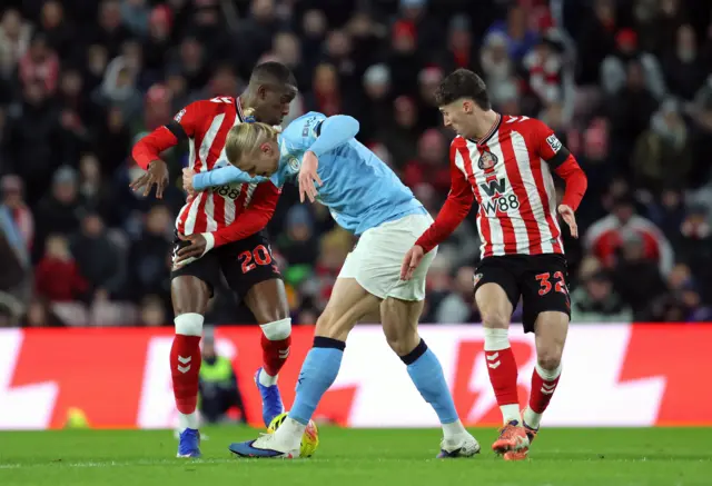 Sunderland's Nordi Mukiele and Manchester City's Erling Haaland battle for the ball