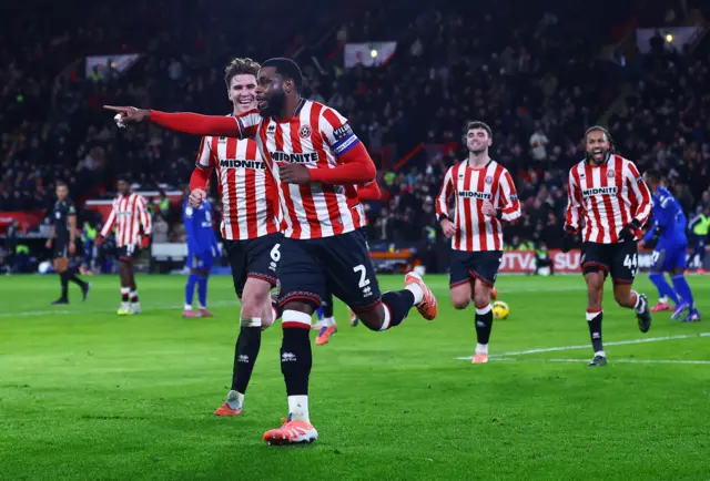 Japhet Tanganga celebrates
