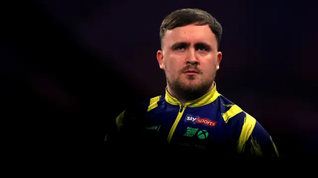 Luke Littler looks on