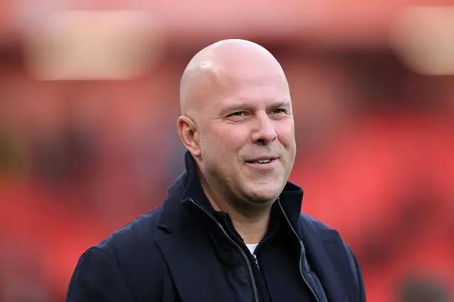 Arne Slot smiles