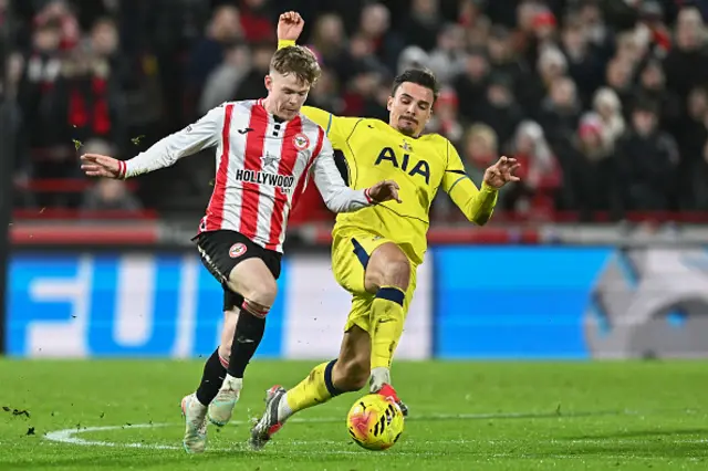 Keane Lewis-Potter of Brentford battles with Joao Palhinha