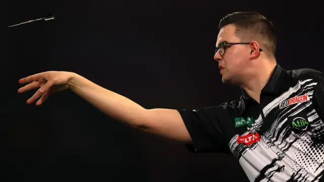 Gian van Veen throws a dart
