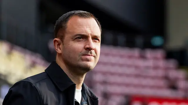 Chris Davies looks on